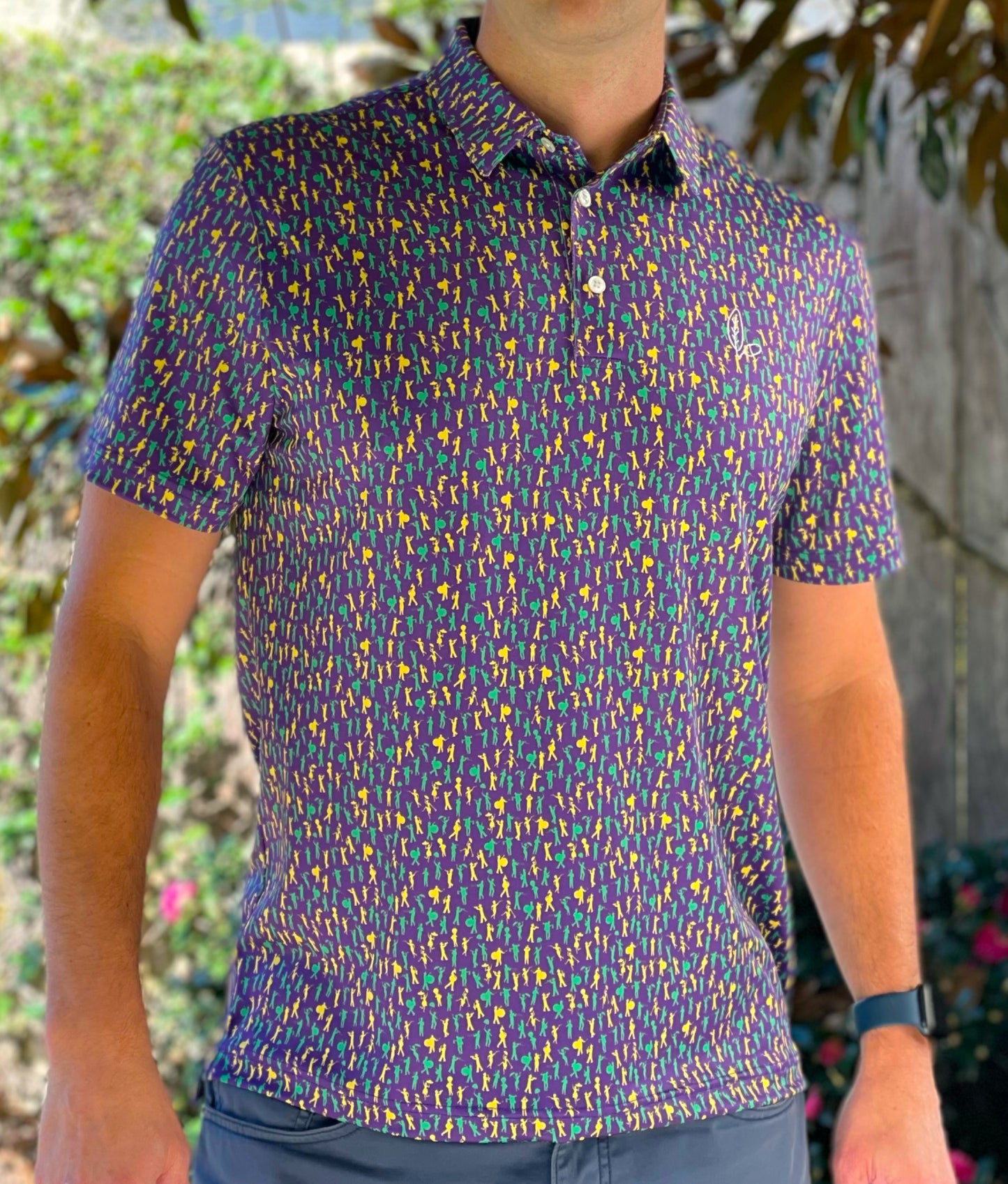Introducing our Mardi Gras Carnival '25 Performance Polo, a pinnacle of style and functionality. Immerse yourself in the Second Line theme featuring unique design elements inspired by the rich culture and energy of the city, you'll stand out in the office our on the parade route.