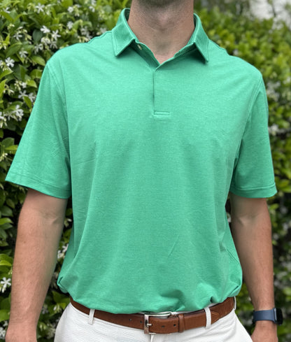 Man wearing Alon's Cafe green Bond Polo with company word mark patch