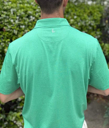 Man wearing Alon's Cafe green Bond Polo with leaf and acorn heat transfer logo.