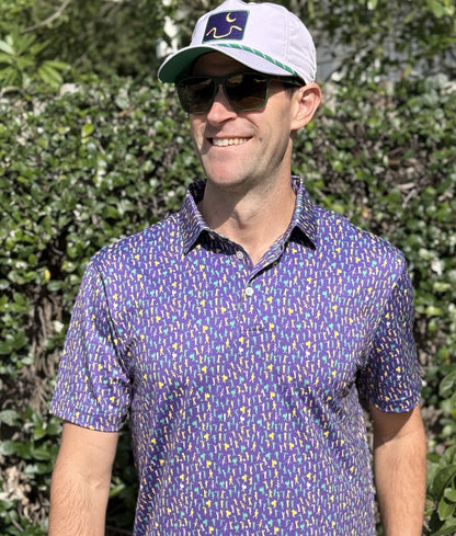 Introducing our Mardi Gras Carnival Performance Polo, a pinnacle of style and functionality. Immerse yourself in the Second Line theme featuring unique design elements inspired by the rich culture and energy of the city, you'll stand out in the office our on the parade route. 