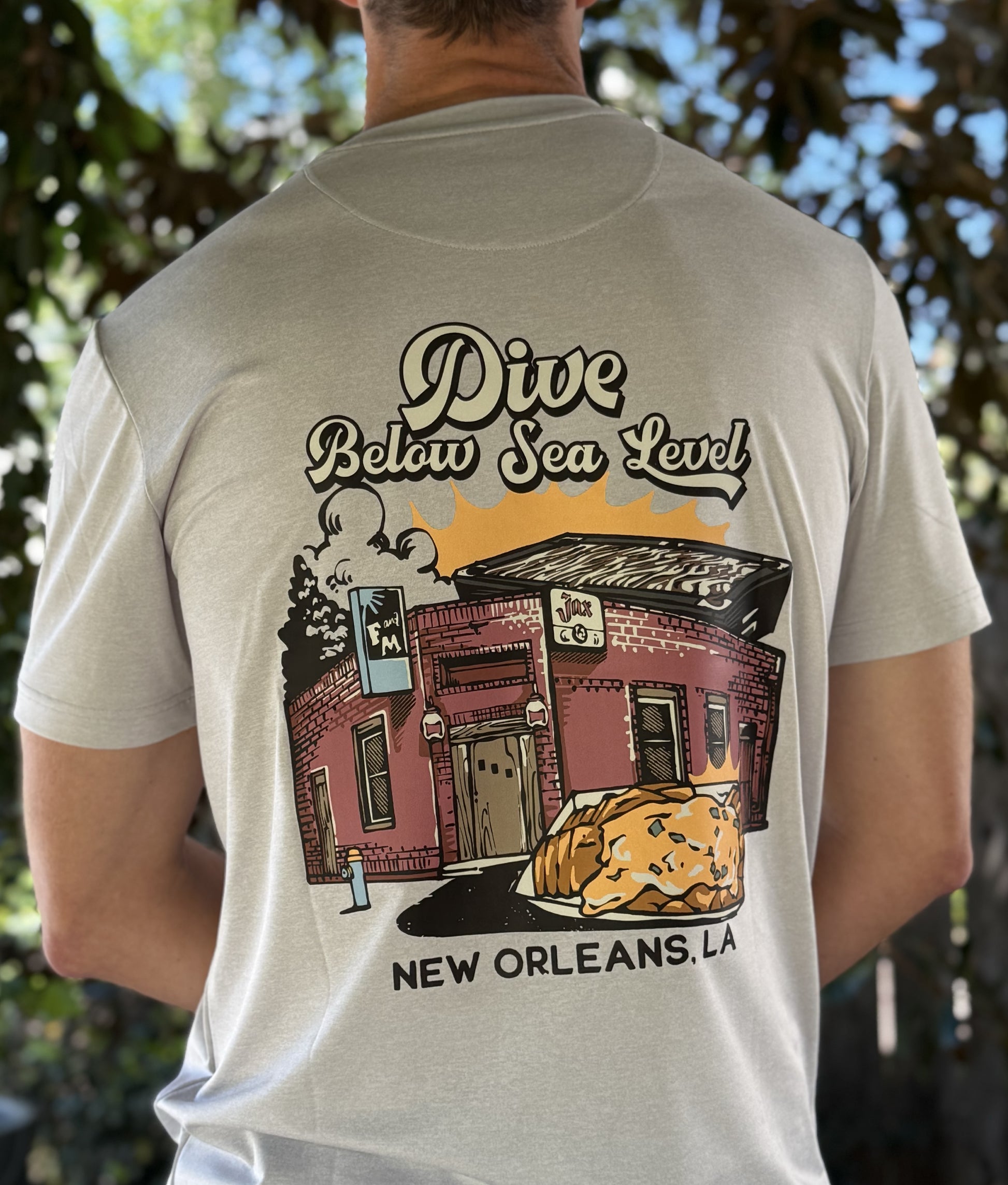 Alon Apparel's exclusive Dive Below Sea Level Pro Pocket tee features local bar graphics on a soft and comfortable performance fabric.