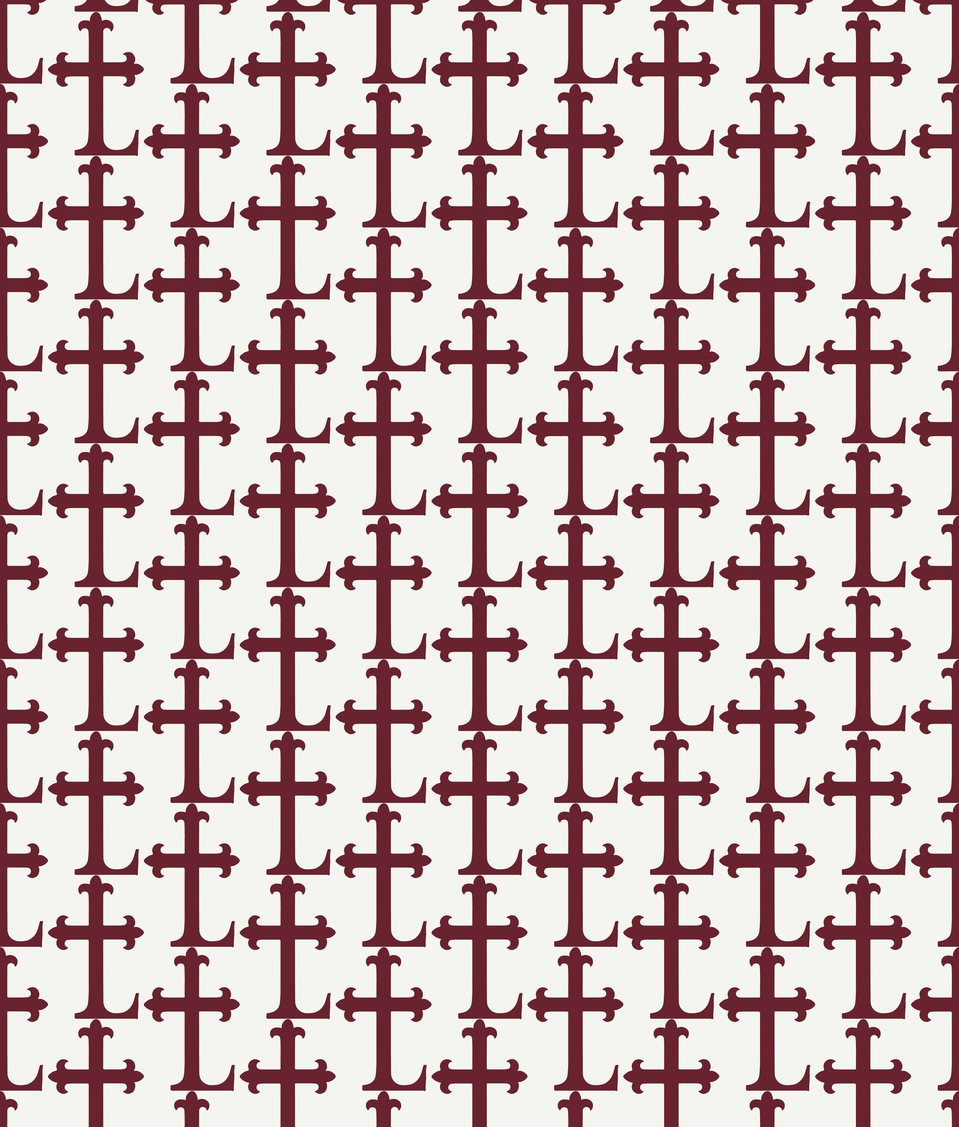 Crimson colored Lasallian cross patterned polo over white fabric.