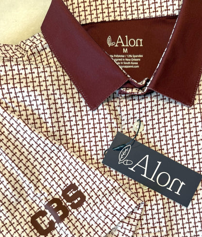 Crimson colored Lasallian cross patterned polo over white fabric.