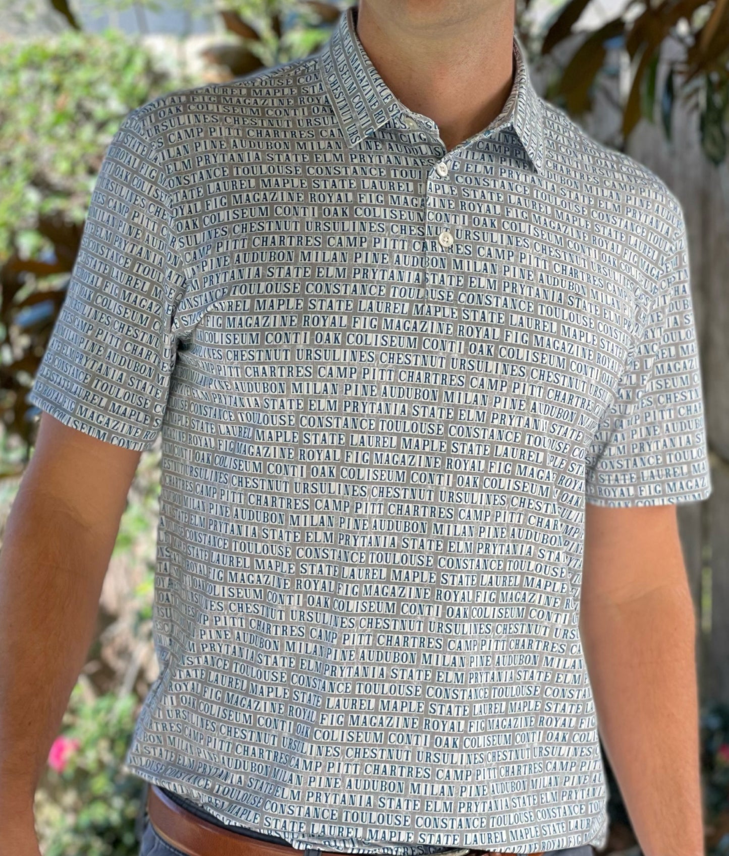 Introducing our Street Tiles Men's Performance Polo, a pinnacle of style and functionality designed to elevate your active lifestyle. Immerse yourself in the spirit of the vibrant New Orleans theme that sets this polo apart. Don the famous tiles spelling out all of the iconic streets of the city you can't help but love!